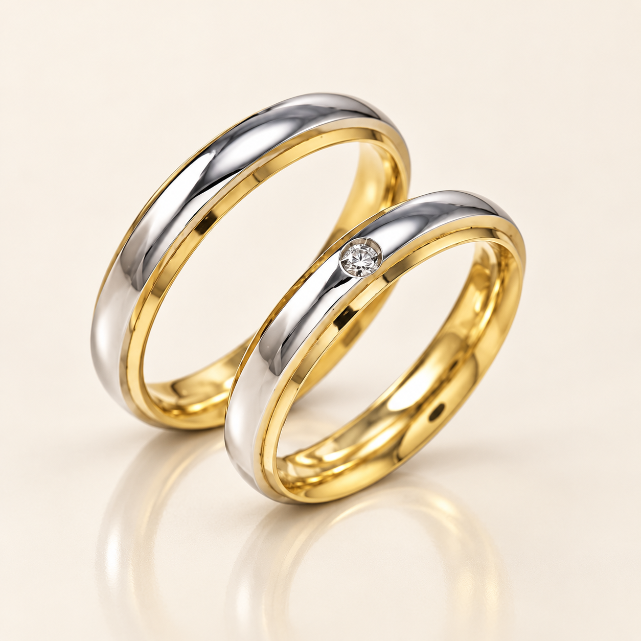 Coppia di fedi bicolore in oro bianco e giallo con diamante